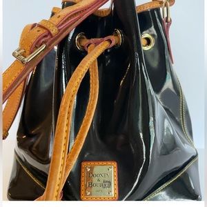Dooney & Bourke black patent leather bucket drawstring bag.